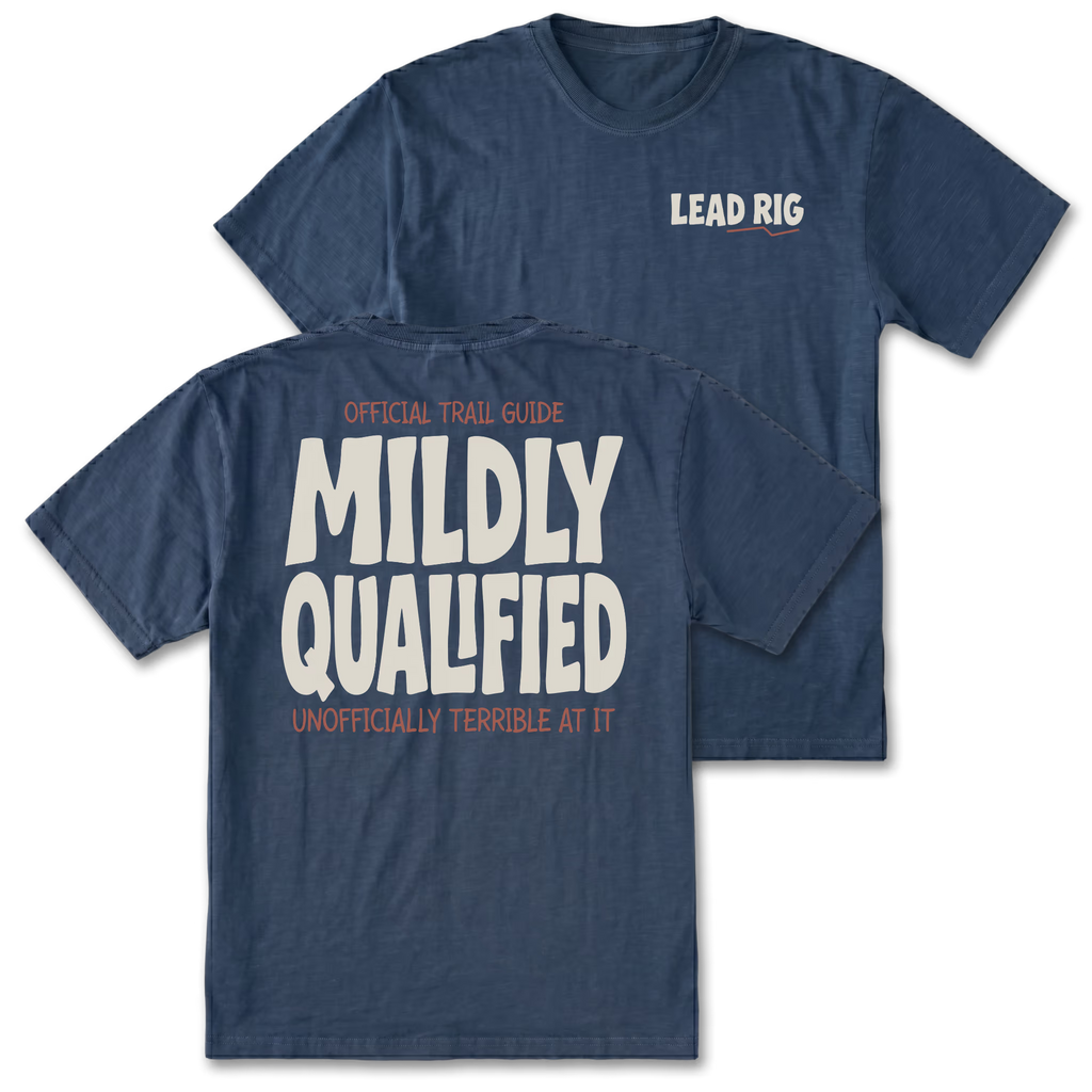 Two navy blue t-shirts shown on a white background, with the front and back views overlapping. The front shirt has 'LEAD RIG' printed in white on the left chest, and the back shirt features large white text reading 'MILDLY QUALIFIED' with smaller orange text above and below.