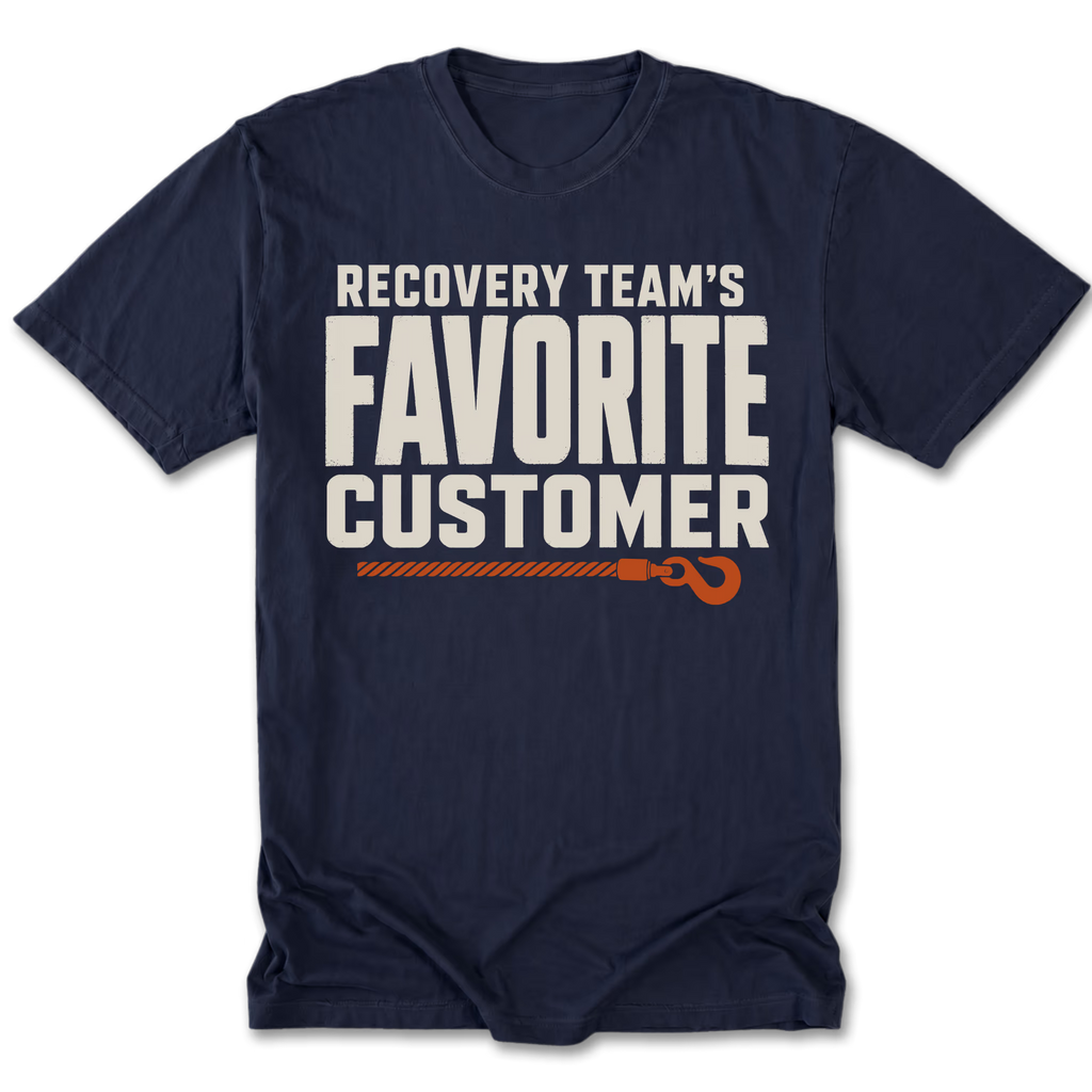 A navy blue short-sleeve t-shirt with a graphic print on the front that reads 'RECOVERY TEAM'S FAVORITE CUSTOMER' in white block letters, with an orange rope and hook illustration underneath.