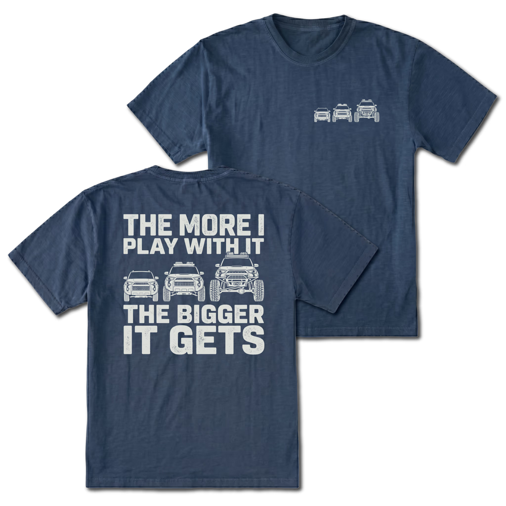 Navy T-shirt with The More I Play With It The Bigger It Gets truck build design shown from the back view by Trail Snark.