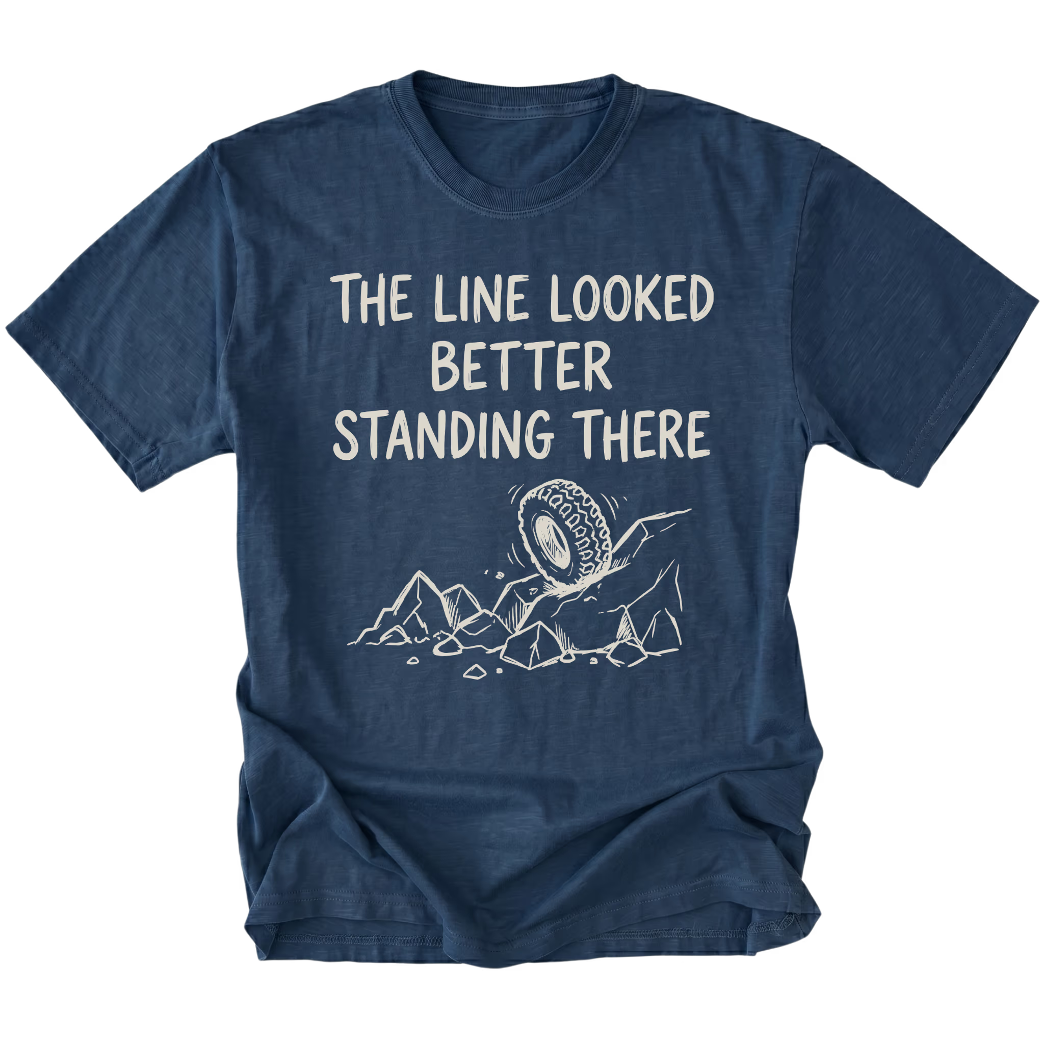 Navy T-Shirt with hand-drawn tire and rocks graphic and text reading “The Line Looked Better Standing There” shown on front view by Trail Snark.