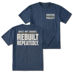 Navy T-Shirt with Ongoing Project front design and Built Not Bought Rebuilt Repeatedly back design shown by Trail Snark.