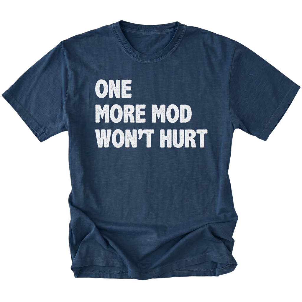 Navy T-Shirt with bold white “One More Mod Won’t Hurt” text shown on front view by Trail Snark.