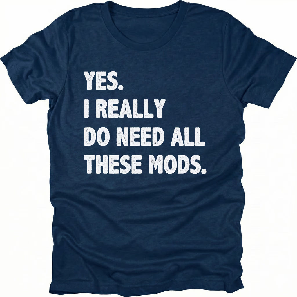 Navy t-shirt with bold white text reading “Yes I Really Do Need All These Mods” displayed on the front by Trail Snark.