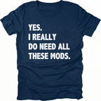 Navy t-shirt with bold white text reading “Yes I Really Do Need All These Mods” displayed on the front by Trail Snark.