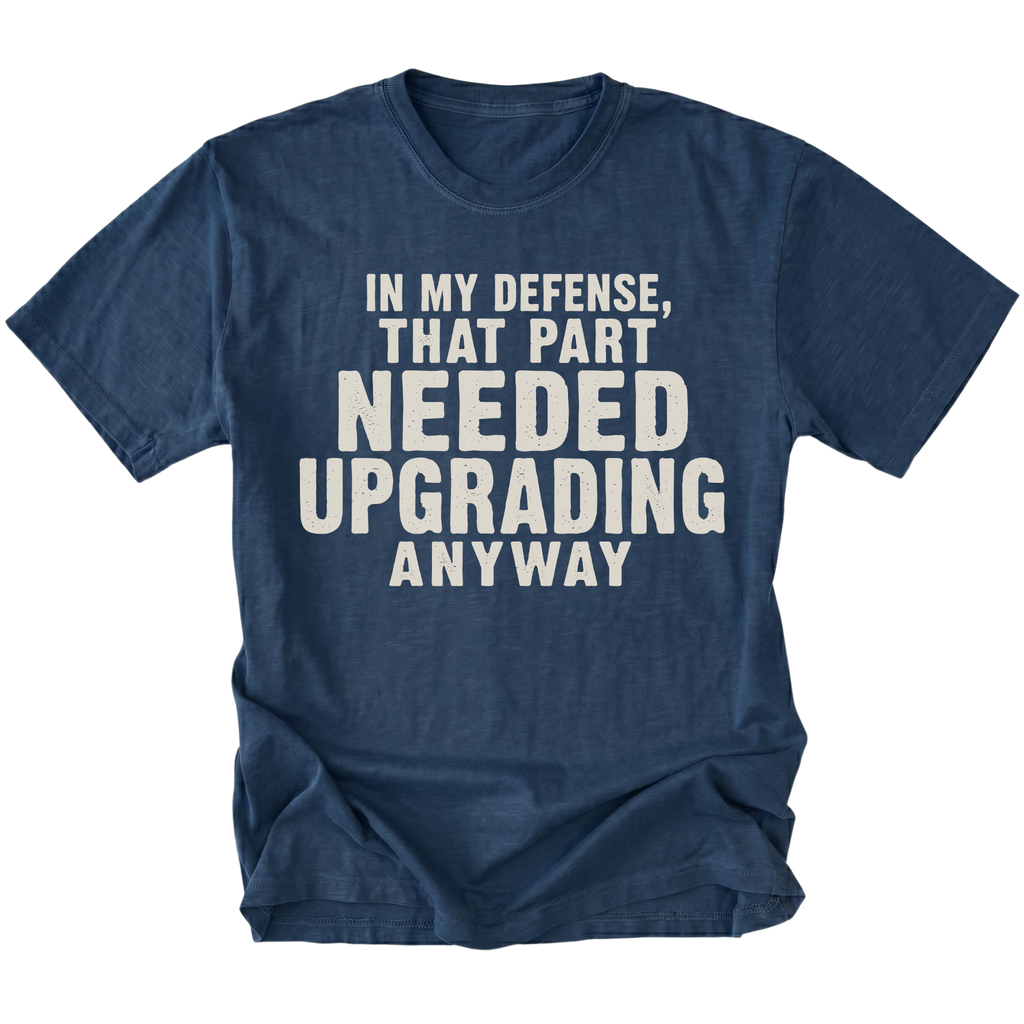 Navy t-shirt featuring the Needed Upgrading design on the front by Trail Snark.