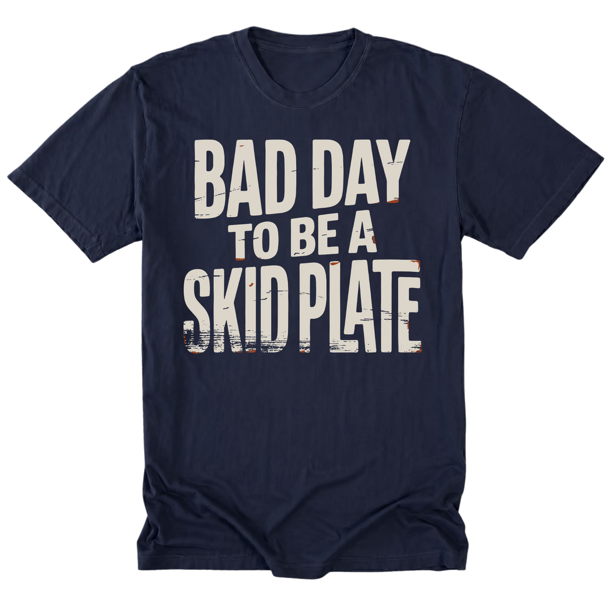 A navy blue tall short-sleeve t-shirt with a distressed white graphic text reading 'BAD DAY TO BE A SKID PLATE' on the front, displayed against a solid white background.