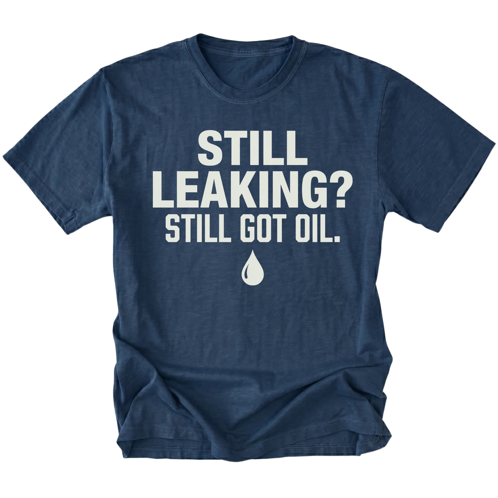 Navy T-Shirt featuring the Still Leaking? Still Got Oil. design with an oil drop graphic on the front view by Trail Snark.