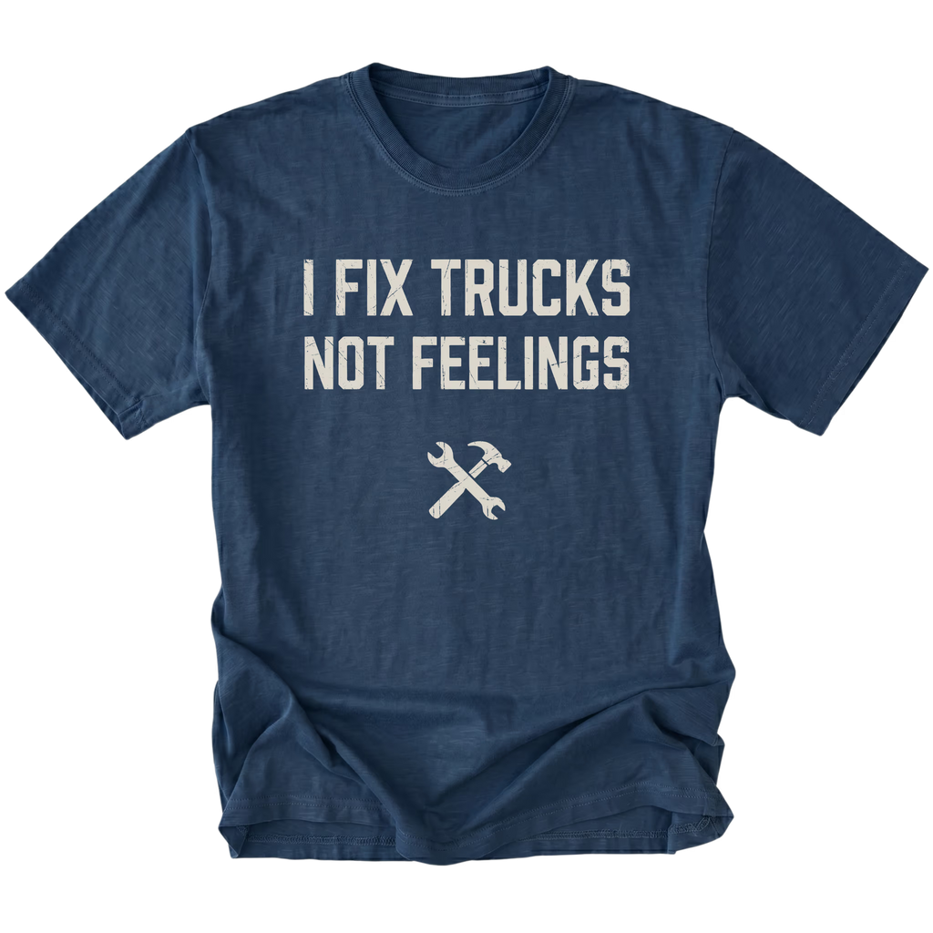 Navy t-shirt with bold distressed text reading I Fix Trucks Not Feelings and crossed wrench and hammer icon.