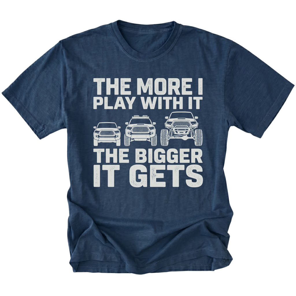 Navy T-Shirt featuring The More I Play With It The Bigger It Gets design with three progressively lifted trucks shown on the front view by Trail Snark.