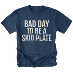 Navy t-shirt featuring bold bad day to be a skid plate text graphic shown from the front by Trail Snark.