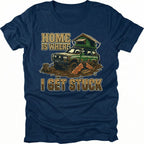 Navy t-shirt featuring an illustrated off-road vehicle stuck in mud with rooftop tent and text reading Home Is Where I Get Stuck.