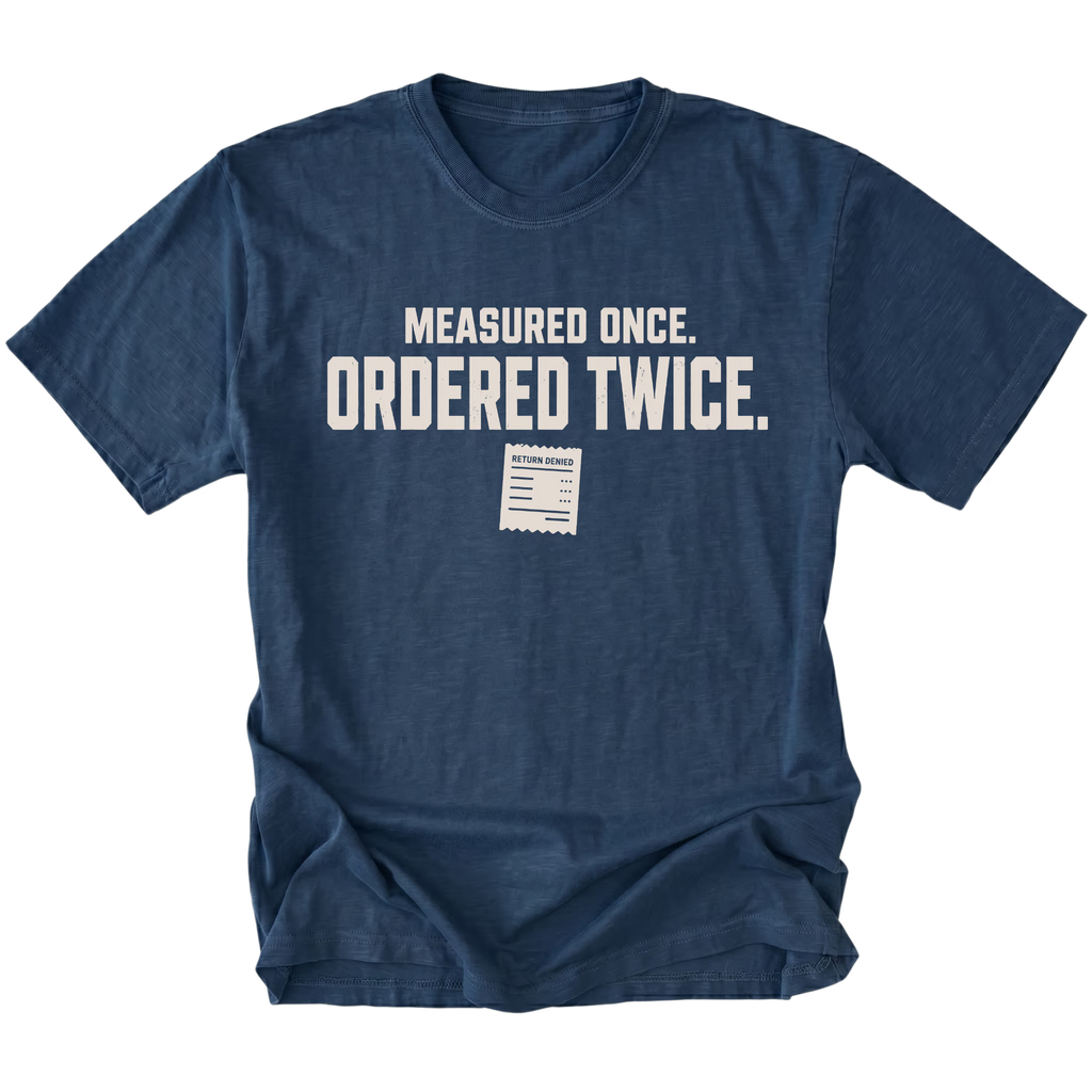 Navy T-shirt with a Measured Once Ordered Twice garage humor design shown from the front by Trail Snark.