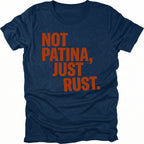 Navy t-shirt with bold rust-colored text reading Not Patina, Just Rust on the front.