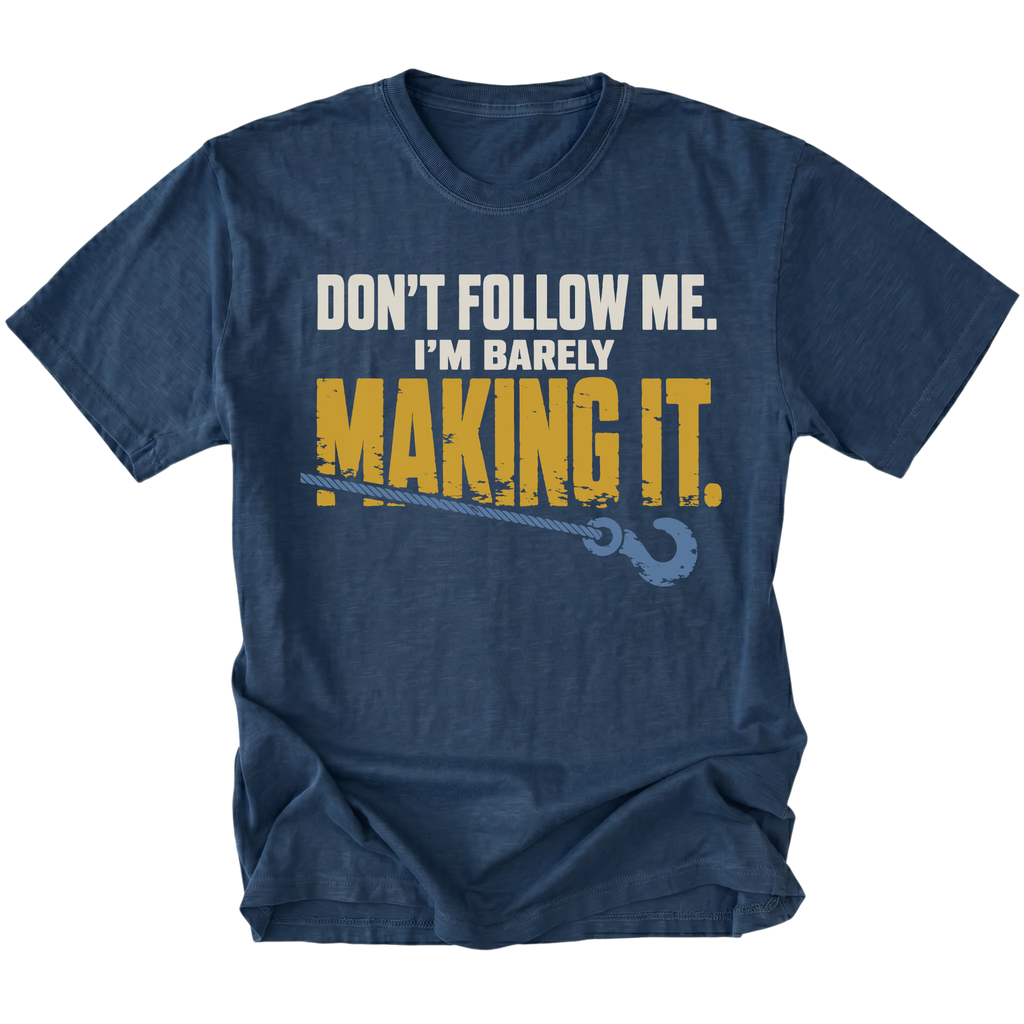 Navy T-shirt featuring the Barely Making It recovery hook design on the front by Trail Snark.